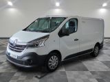the white van is parked on a checkered floor in a room
