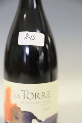 a bottle of wine that is sitting on a table