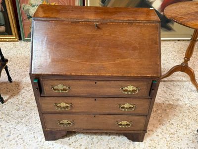 a small wooden desk with a drawer on top of it