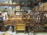 a room filled with lots of old furniture in it