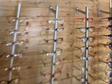 many pairs of glasses on display in a store