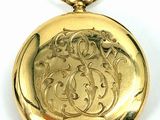 an image of a gold pocket watch on a white background