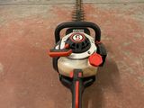 a chainsaw that is sitting on the ground