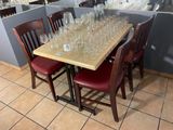 many empty wine glasses sitting on a table in a restaurant