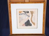 painting of a woman in a hat on a wooden easel