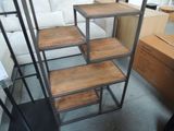 a set of four shelves that are in a room