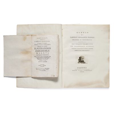 an open book with a picture of a man sitting on top of it