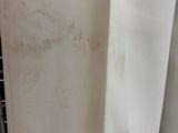 a lot of stains on the curtain in the bathroom
