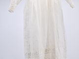 an image of a white dress hanging on a hanger