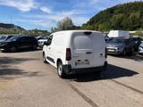 a white van that is parked in a parking lot