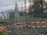 a fence that has been set up in front of a building