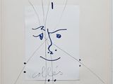 dessin représentant le visage d'un homme sur une feuille de papier comportant des inscriptions