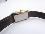 a close up of a watch on a white surface