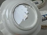 a person holding a plate with a picture of a train on it