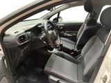 the interior of a car with the door open and the driver ' s seat down