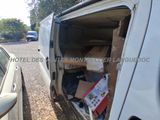 a white van that has a bunch of boxes in the back of it