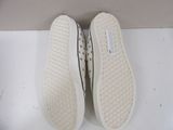vans slip on shoes with white soles on a white surface
