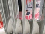 a radiator that has a bunch of toothbrushes in it