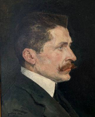 portrait d'un homme moustachu en costume-cravate