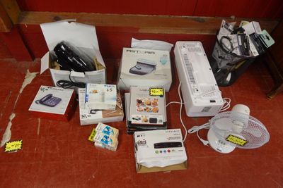 a lot of electronics that are sitting on the floor