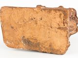 a small piece of wood that is sitting on a white surface
