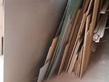 a large pile of cardboard and other items in a room