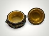 a pair of gold and turquoise glass bowls