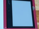 a tablet computer sitting in a pink box on a table