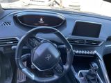 the interior of a car with a steering wheel and dashboard controls
