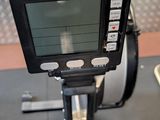 a monitor that is sitting on a machine in a gym