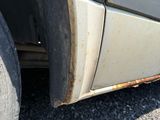 a close up of a car tire with rust on it