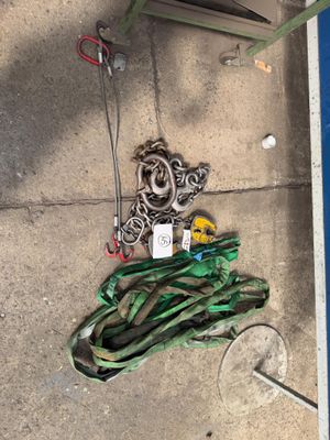 a bunch of rope and a bottle of water on the ground