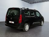 a picture of a black van parked in a room