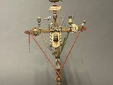 an image of a metal candelab with a bird on top of it