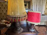 two lamps that are sitting on a table in a room