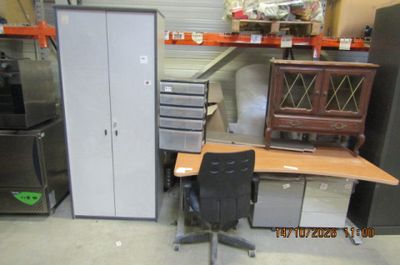 a desk with a chair and a cabinet in a room
