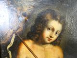 un tableau représentant un jeune garçon tenant un bâton à la main
