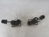 two metal objects sitting on top of a table next to each other