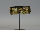 an image of a hat made out of coins on a stand