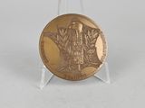 an image of a gold medal on a clear stand