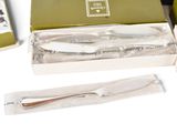 a box with a knife, fork, and other items in it