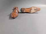 pair of men ' s shoes on a grey surface