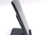 a close up of a cell phone on a stand