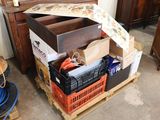 a pile of boxes on a pallet in a room