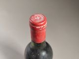 a bottle of wine that is sitting on a table