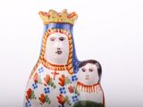 a figurine of a mother and child with a crown on her head