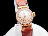 a watch that is sitting on top of a white plate