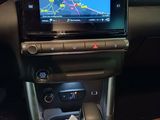 the dashboard of a car with a gps device in the center of it