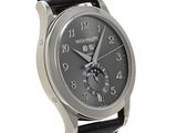 an image of a wrist watch with a black dial and black leather strap