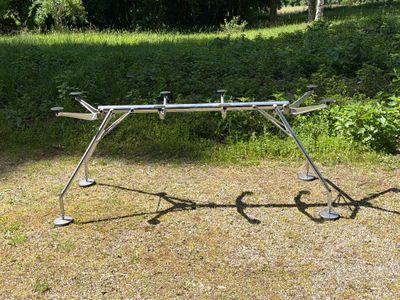 a large metal structure that is sitting in the middle of a field